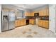Spacious kitchen with stainless steel appliances, tile backsplash, and tile flooring at 5392 Fox Creek Ln, Norcross, GA 30071