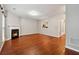 Inviting living room with fireplace and hardwood floors, creating a cozy living space at 5392 Fox Creek Ln, Norcross, GA 30071
