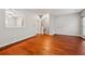 Spacious living room with hardwood floors and neutral paint, offering a welcoming atmosphere at 5392 Fox Creek Ln, Norcross, GA 30071