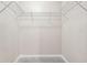 Empty walk-in closet with carpet and wire shelving for optimal storage at 5392 Fox Creek Ln, Norcross, GA 30071