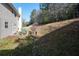 View of the backyard with a fence and green space at 1893 Tulip Petal Rd, Auburn, GA 30011