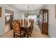 Formal dining room featuring a grand table, sophisticated decor, and open access to adjacent living spaces at 1893 Tulip Petal Rd, Auburn, GA 30011