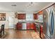 Charming kitchen featuring stainless steel appliances and a view to the backyard at 1893 Tulip Petal Rd, Auburn, GA 30011