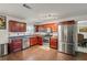 Well-lit kitchen features stainless steel appliances and beautiful wood flooring at 1893 Tulip Petal Rd, Auburn, GA 30011