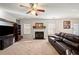 Spacious living room with a fireplace and natural light, creating a warm atmosphere at 1893 Tulip Petal Rd, Auburn, GA 30011