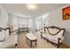 Elegant living room featuring ornate furniture, bright natural light, and a welcoming atmosphere at 1893 Tulip Petal Rd, Auburn, GA 30011