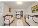 Bright and airy living room with classic decor and an open layout leading to the dining area at 1893 Tulip Petal Rd, Auburn, GA 30011