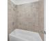 Modern bathroom showcasing a tiled shower with neutral color scheme at 6055 Misty Hill Ln, Buford, GA 30518