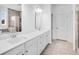 Bright bathroom featuring double vanity, tile flooring, and separate tub and shower at 6055 Misty Hill Ln, Buford, GA 30518