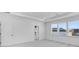 Airy bedroom featuring neutral carpet, many windows with neighborhood views and a walk-in closet at 6055 Misty Hill Ln, Buford, GA 30518