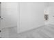 Bright bedroom featuring soft carpet and a walk-in closet at 6055 Misty Hill Ln, Buford, GA 30518