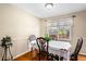 Charming dining room featuring hardwood floors and a bright window with decorative curtains at 13 Greystone Nw Ln, Cartersville, GA 30121