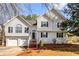 Charming two-story home featuring a two-car garage, arched entry, and manicured front yard at 13 Greystone Nw Ln, Cartersville, GA 30121