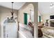 Bright foyer with chandelier, leads to a cozy living room with fireplace and vaulted ceiling at 13 Greystone Nw Ln, Cartersville, GA 30121