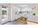 Bright kitchen with white cabinetry, stainless steel appliances, and a view of the outdoor deck at 13 Greystone Nw Ln, Cartersville, GA 30121