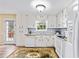 Clean, updated kitchen with white cabinetry, matching appliances, and ample natural light from the exterior at 13 Greystone Nw Ln, Cartersville, GA 30121