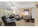 Living room with comfortable seating, a piano, neutral walls, a divider, and a window at 13 Greystone Nw Ln, Cartersville, GA 30121
