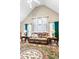 Cozy living room showcasing large windows, vaulted ceiling, and plush comfortable seating at 13 Greystone Nw Ln, Cartersville, GA 30121