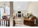Inviting living room with vaulted ceiling, stone fireplace, and comfortable seating at 13 Greystone Nw Ln, Cartersville, GA 30121