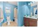 Freshly painted blue bathroom with window next to the toilet and vanity at 134 Paces Lakes Overlook, Dallas, GA 30157