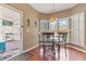 Cozy breakfast nook with bright windows and access to a screened in back porch at 134 Paces Lakes Overlook, Dallas, GA 30157