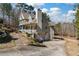 Charming home featuring a well-manicured yard, a covered front porch, and an attached two-car garage at 134 Paces Lakes Overlook, Dallas, GA 30157
