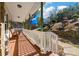 Inviting front porch with rocking chairs offering a relaxing outdoor space and views of the yard at 134 Paces Lakes Overlook, Dallas, GA 30157