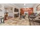 Relaxing living room with a cozy fireplace, neutral paint colors, and tile flooring at 134 Paces Lakes Overlook, Dallas, GA 30157