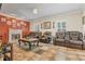 Inviting living room featuring a fireplace, tile flooring, and comfortable leather seating at 134 Paces Lakes Overlook, Dallas, GA 30157