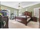 Main bedroom featuring a king sized bed, ceiling fan, and a treadmill at 134 Paces Lakes Overlook, Dallas, GA 30157