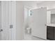 Bathroom with gray vanity and white toilet seen through open door at 306 Bunker Hill Ct, Acworth, GA 30102