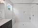 Modern bathroom with white tiled shower, bench seating, and chrome fixtures at 306 Bunker Hill Ct, Acworth, GA 30102