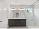 Bright bathroom with double vanity, large mirror, and tile shower with built-in bench at 306 Bunker Hill Ct, Acworth, GA 30102
