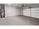 Spacious two car garage with water heater and neutral color palette at 306 Bunker Hill Ct, Acworth, GA 30102