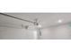 Spacious garage with white walls, concrete floor, and garage door opener at 306 Bunker Hill Ct, Acworth, GA 30102