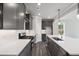 Close-up of kitchen featuring stainless steel appliances, white countertops, gas range, and gray cabinetry at 306 Bunker Hill Ct, Acworth, GA 30102