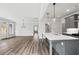 Open-concept living area features modern finishes and a seamless flow from kitchen to living room at 306 Bunker Hill Ct, Acworth, GA 30102