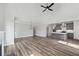 Spacious living room showcases an open layout, modern lighting, and connection to the kitchen at 306 Bunker Hill Ct, Acworth, GA 30102