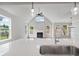 Open concept living room with cathedral ceilings, a fireplace, and large windows providing natural light at 306 Bunker Hill Ct, Acworth, GA 30102