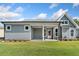 Charming home showcasing a covered patio perfect for outdoor entertaining and a spacious, well-manicured lawn at 306 Bunker Hill Ct, Acworth, GA 30102