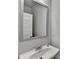 Neutral bathroom with a white sink, modern faucet, and a stylish mirror at 3328 Sir Gregory Mnr, Lawrenceville, GA 30044