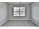 Neutral bedroom with a gray carpet and a window with natural light at 3328 Sir Gregory Mnr, Lawrenceville, GA 30044