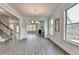 Spacious dining room featuring a modern chandelier and large windows at 3328 Sir Gregory Mnr, Lawrenceville, GA 30044