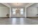 Dining room featuring a modern chandelier and two large windows at 3328 Sir Gregory Mnr, Lawrenceville, GA 30044