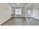 Bright and airy living room with large windows, hardwood floors, and modern accents at 3328 Sir Gregory Mnr, Lawrenceville, GA 30044