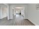Spacious living room with wide plank floors and view of the fireplace at 3328 Sir Gregory Mnr, Lawrenceville, GA 30044