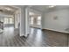 Open-concept living room featuring wide plank floors and large windows at 3328 Sir Gregory Mnr, Lawrenceville, GA 30044