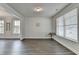 Bright and airy living room with large windows, hardwood floors, and modern accents at 3328 Sir Gregory Mnr, Lawrenceville, GA 30044