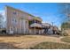 Exterior view of the house featuring a well-maintained lawn, a porch, and a deck at 83 Southshore Ln, Dallas, GA 30157