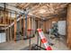 Unfinished basement space with exposed ducts and framed walls can be customized at 83 Southshore Ln, Dallas, GA 30157
